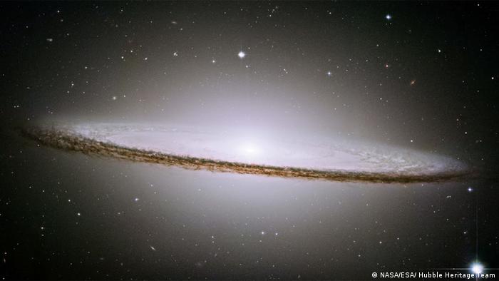 NASA's Hubble Space Telescope has trained its razor-sharp eye on one of the universe's most stately and photogenic galaxies, the Sombrero galaxy, Messier 104 (M104). The galaxy's hallmark is a brilliant white, bulbous core encircled by the thick dust lanes comprising the spiral structure of the galaxy.