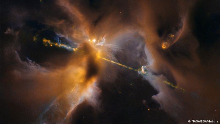 Two cosmic jets beam outward from a newborn star in a galaxy